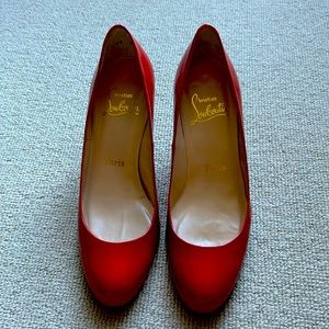 Authentic Christian Louboutin Simple Pump 70 in patent red leather.